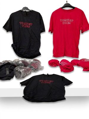 three t - shirts and a pair of boxing gloves on a shelf