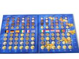a close up of a blue box of coins with different countries on it