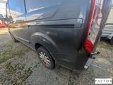 the rear end of a black van parked in a parking lot