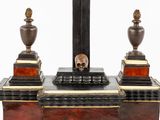 an image of a clock with a skull on it