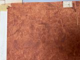 a piece of brown leather on the table