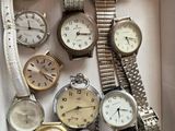 many different types of watches in a box