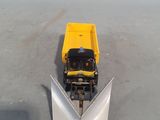 a yellow truck with a snow plow attached to it ' s back