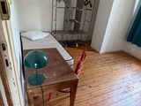 a room with a table and a chair in it