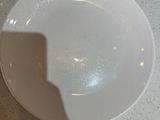 a white plate that is sitting on a table
