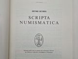 an open book with the title scriptta numismatica on it