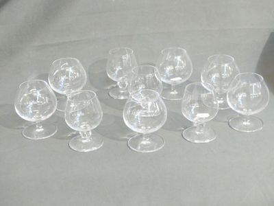 many empty wine glasses sitting on a table