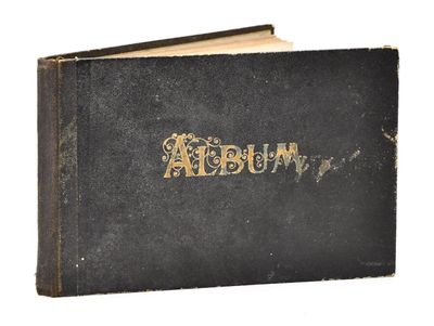 an old book with the word album written in gold on it