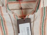 a close up of a shirt with a tag on it