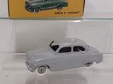 a toy car that is on display in a glass case