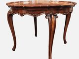 an old wooden table with a carved top on a white background