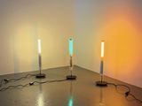two lights that are on a table in a room