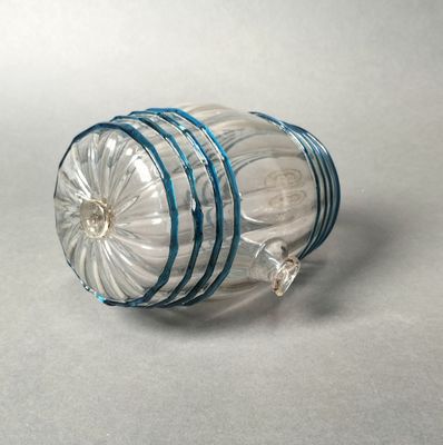 a clear glass jar with a blue stripe around it