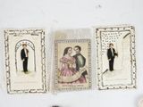 three cards that have pictures of a man and a woman on them