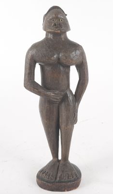 an image of a wooden statue of a man with his hands on his hips