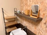 a bathroom with a sink and a mirror on the wall