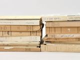 many books stacked on top of each other on a table