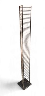 a close up of a tall metal object on a white background
