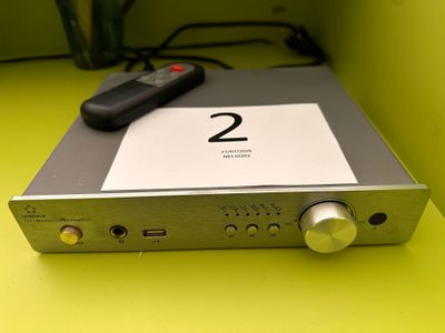 a picture of a remote control sitting on top of a silver box