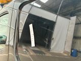 a car that has a sticker on the side of it ' s window