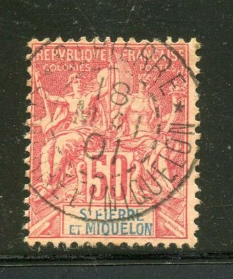 le timbre est rouge et noir et représente un homme à cheval