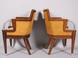 a pair of mid century style chairs with yellow upholstered upholstered seats