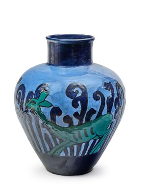 a blue vase with a painting on it on a white surface