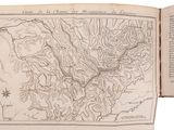 an open book with a map of the mountains and rivers in it
