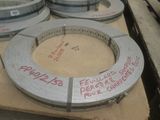 a lot of metal rings that are stacked on a table