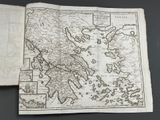 an old book with a map of greece on it