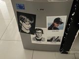 a refrigerator that has pictures on it in a kitchen
