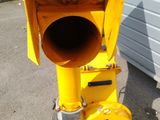 a yellow traffic light sitting on the side of the road