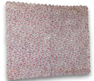 a close up of a crocheted pillow on a white background