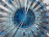 a picture of a blue and white umbrella with a hole in the middle