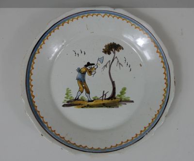 une assiette avec l'image d'un homme et d'un chien