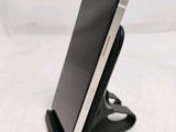 a cell phone that is sitting on a stand