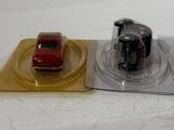 a small red car and a small red car on a plate