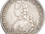 a close up of a silver coin with a woman on it