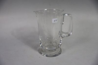 a glass mug that is sitting on a table