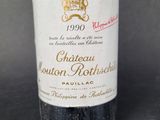 a bottle of wine that is sitting on a table