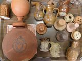 a tray that has many different types of pottery on it