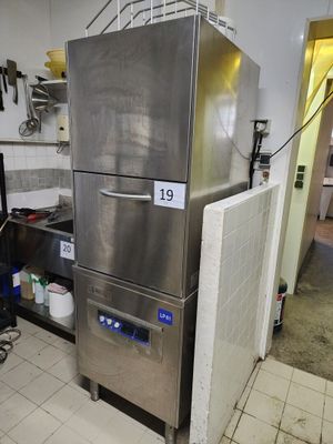 a large stainless steel refrigerator in a kitchen with a lot of counter space