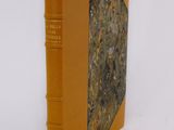 a small book that is sitting on a white surface