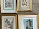 four framed pictures of buildings and a castle in a gold frame