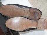 a pair of shoes that are sitting on a window sill