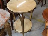 a table with a marble top and chairs in the background