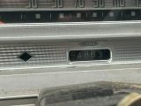 a close up of an old fashioned radio with a clock on it