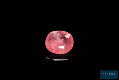 a pink diamond on a black background