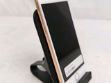 a cell phone that is sitting on a stand
