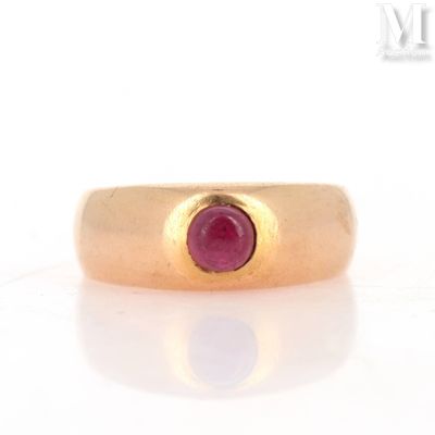 an image of a gold ring with a ruby stone